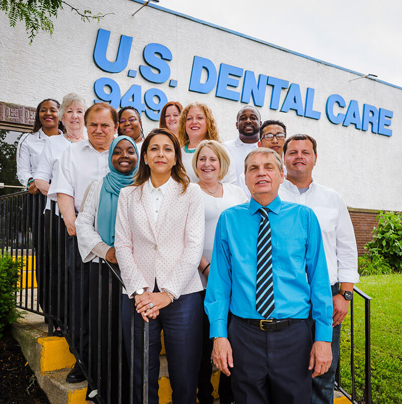 us-dental-mobile-banner The team standing in front of the US Dental office.