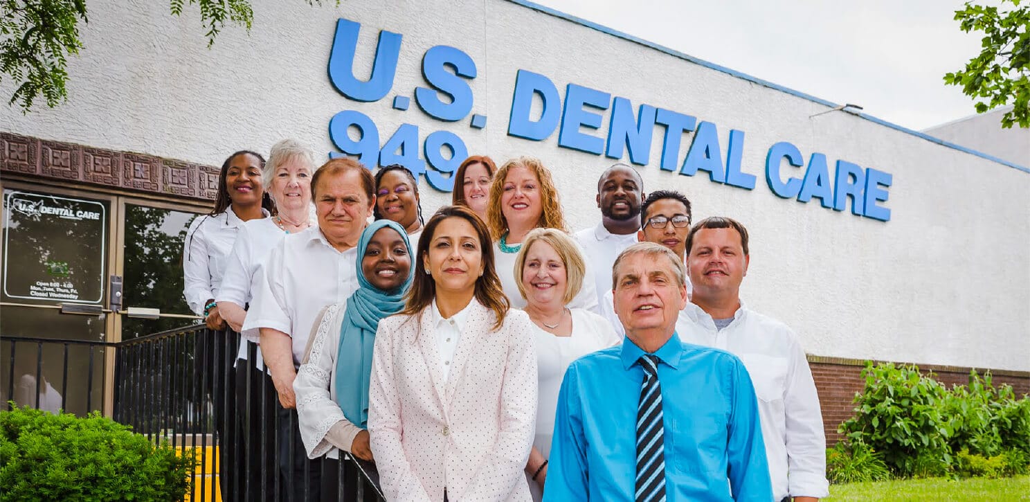 Dental Care Team Posing Before U.S. Dental Care Office In Columbus