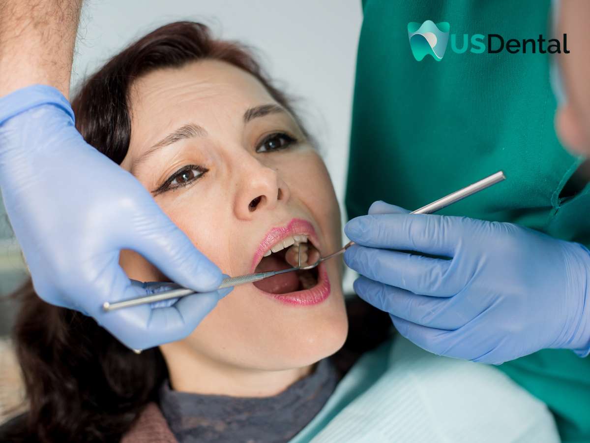 Patient receiving dental treatment to prevent dental emergencies at a clinic.
